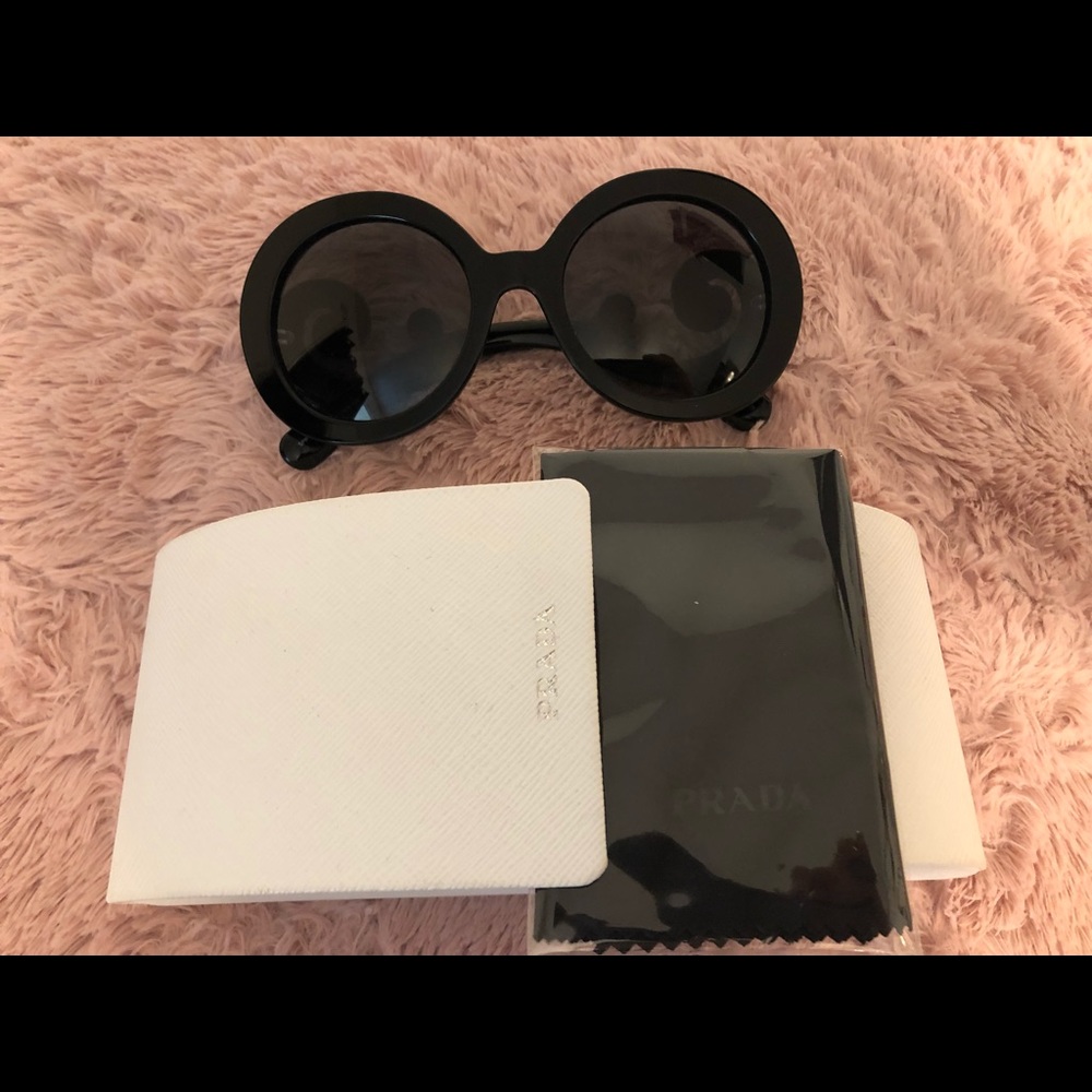 Prada Baroque swirl round glasses.